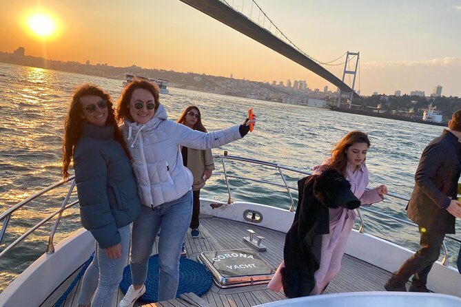 Bosphorus Sunset Yacht Cruise with Snacks and Live Guide - From Galata Tower to Dolmabahçe Palace: palaces and city silhouettes